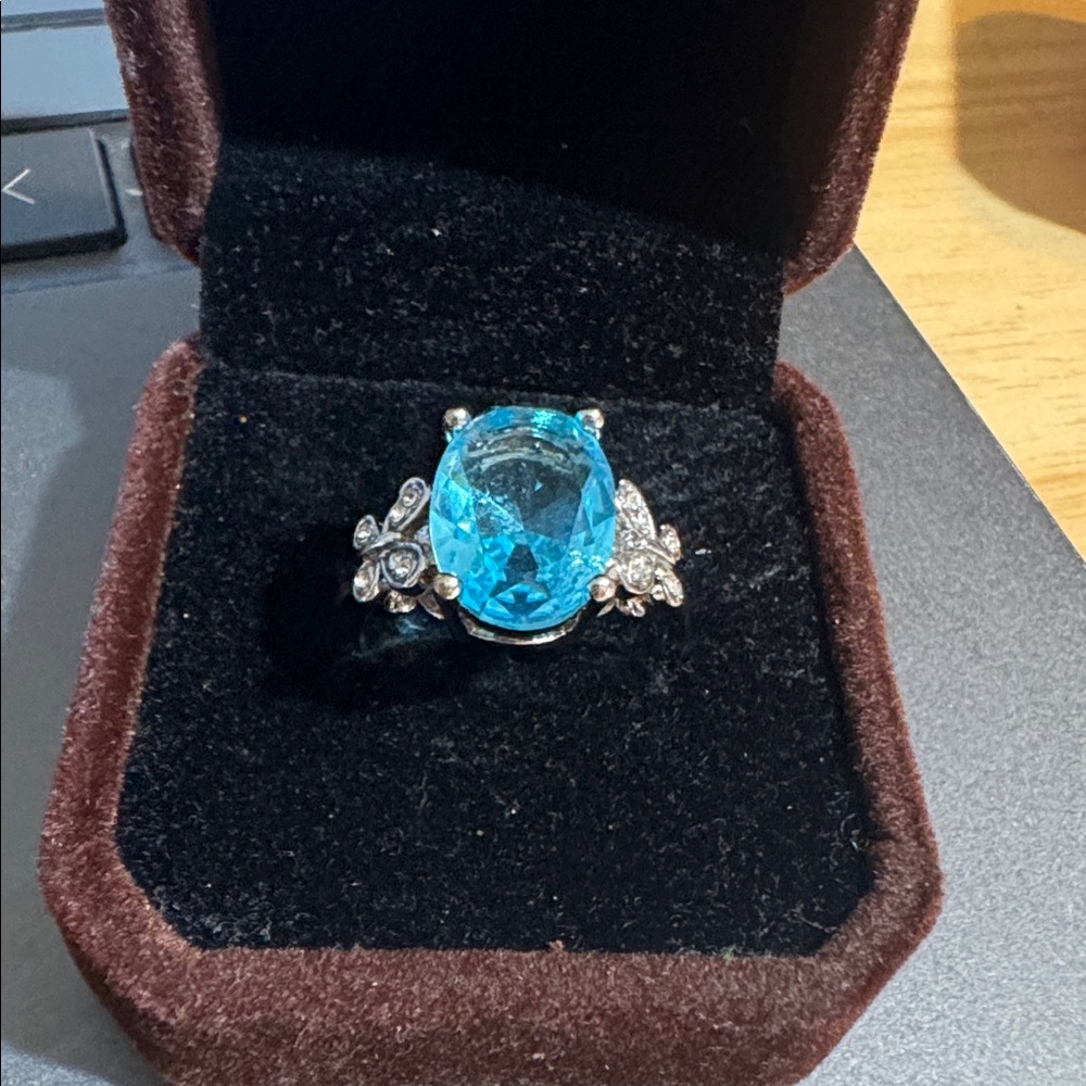 Elegant Sky Blue Tpaz Ring with Crystal and Silver Accents
